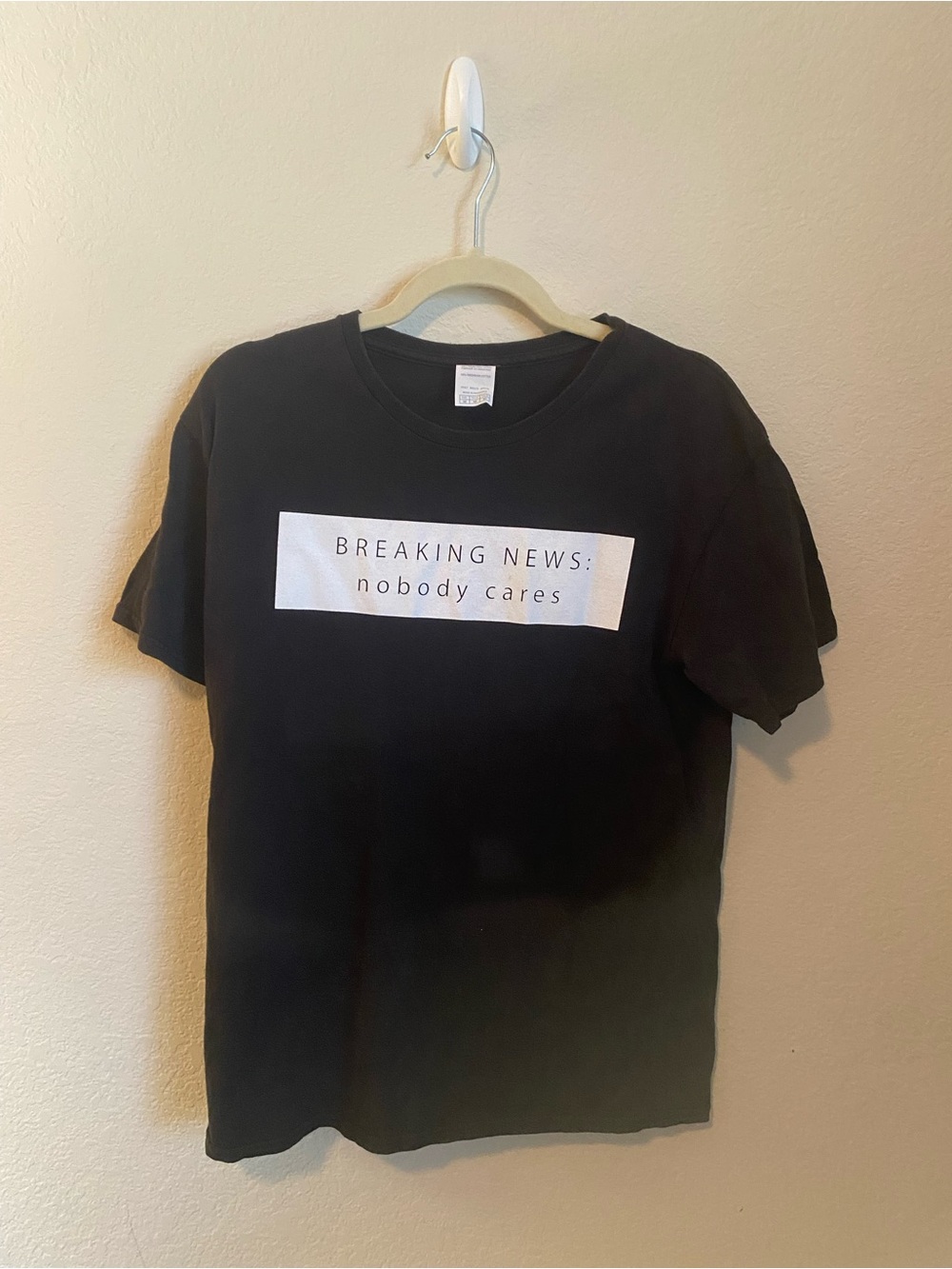 Black "Breaking News: nobody cares" Graphic Tee